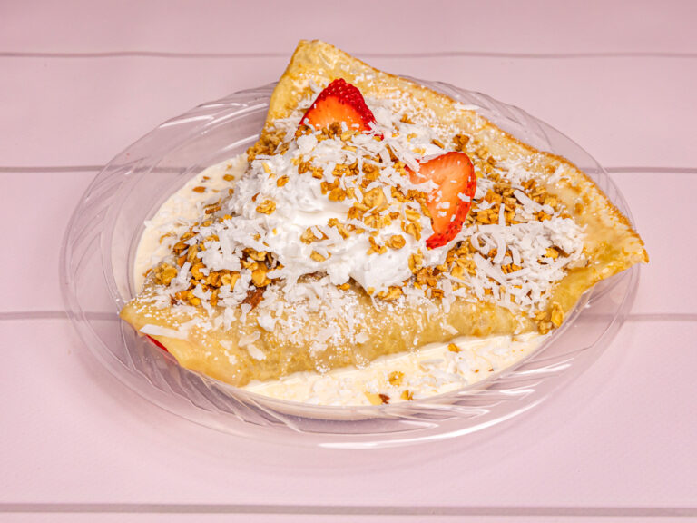 Fresas con Crema crepe filled with sweet cream and strawberries, topped with granola and coconut