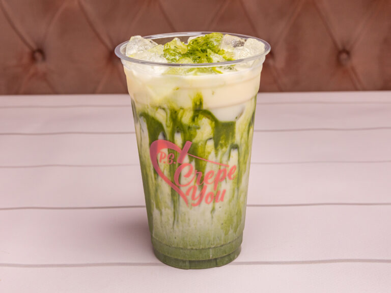 Layered iced horchata matcha in a clear cup